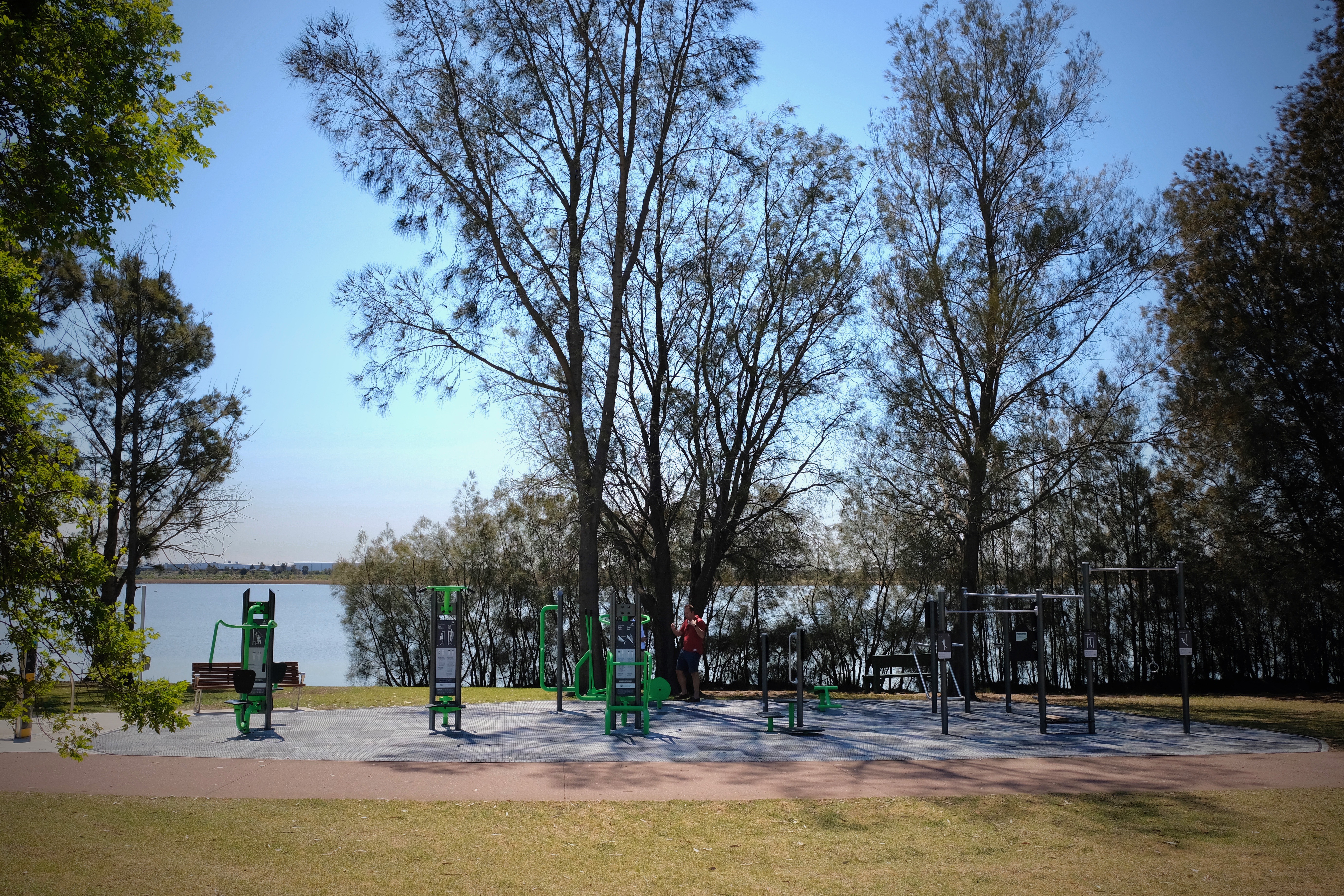 The a_space outdoor fitness equipment in Kermit Green pops against this serene background and brings community together. 