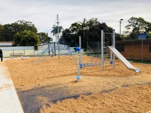 A 6m Activity Net is linked to a stainless steel slide with a custom net from a_space at Mannering Park Playspace