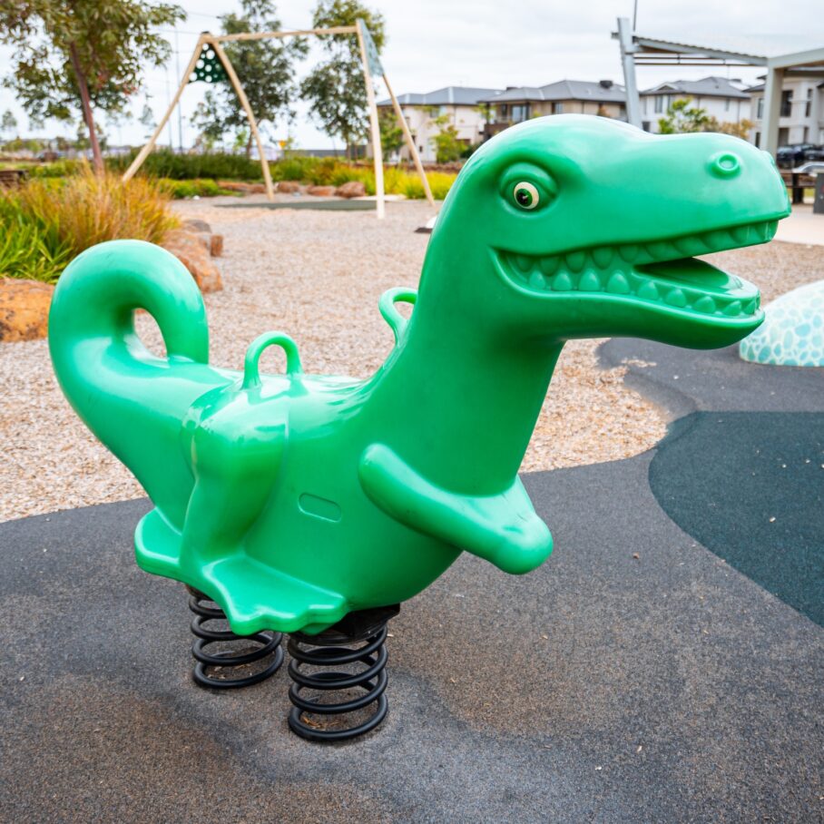 Green dinosaur play equipment