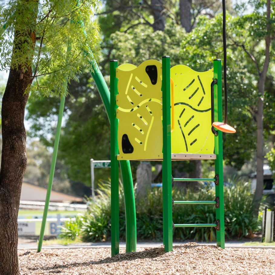 Green and yellow playground tower