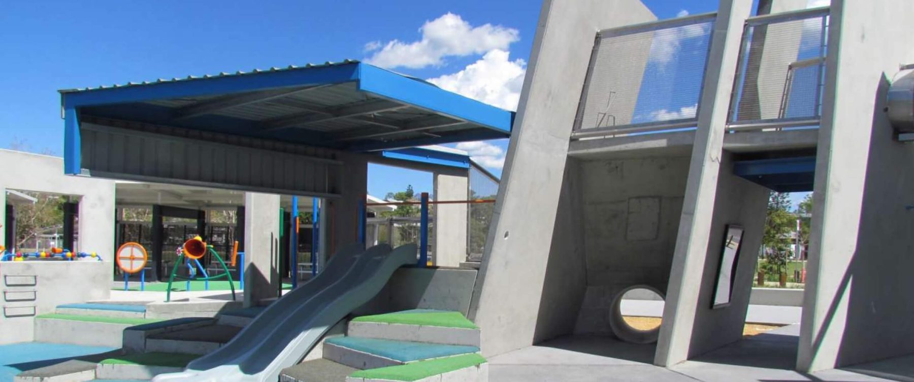 a slide covered by a blue roof