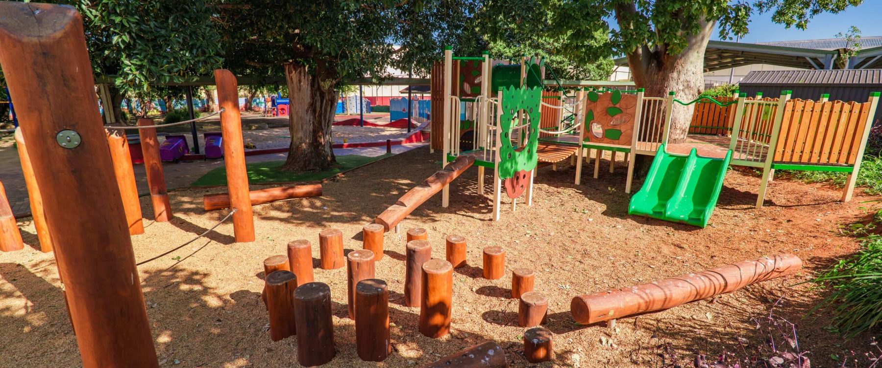 a group of wooden poles arranged in a spiral pattern