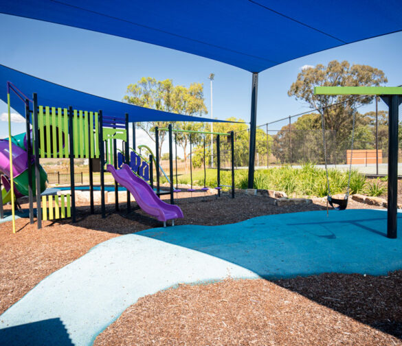 Jerry plains purple, yellow and blue playground with shade sail